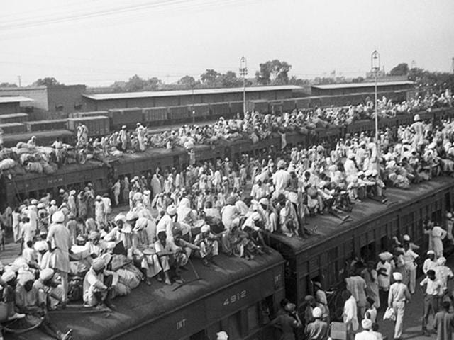 A train crammed with refugees leaves for Pakistan from the border city of Amritsar in 1947. Although these trains traveled on confidential routes with armed guards, they were still attacked. After one such attack, photojournalist Margaret Bourke-White arrived at the Amritsar station to find men from the “militant Akhali sect..sitting cross-legged” on the platform, sword in hand, “patiently waiting for the next train.”(Getty Images) A train crammed with refugees leaves for Pakistan from the border city of Amritsar in 1947. Although these trains traveled on confidential routes with armed guards, they were still attacked. After one such attack, photojournalist Margaret Bourke-White arrived at the Amritsar station to find men from the “militant Akhali sect..sitting cross-legged” on the platform, sword in hand, “patiently waiting for the next train.”(Getty Images)
