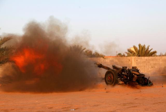 A photo taken on August 15, 2016 shows Libyan forces fire an artillery cannon at IS positions in Sirte. (REUTERS) A photo taken on August 15, 2016 shows Libyan forces fire an artillery cannon at IS positions in Sirte. (REUTERS)