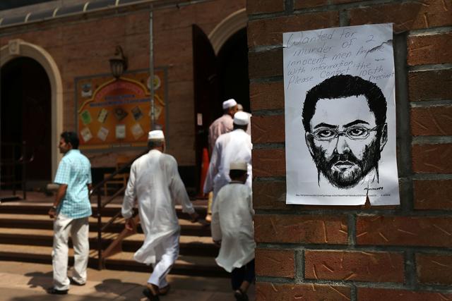 A sketch of a suspect is taped to a wall outside of a mosque near where Imam Maulama Akonjee and his assistant, Thara Uddin, 64, were killed. (AFP) A sketch of a suspect is taped to a wall outside of a mosque near where Imam Maulama Akonjee and his assistant, Thara Uddin, 64, were killed. (AFP)