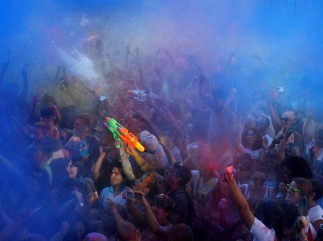 Revellers take part in the Monsoon Holi Madrid festival in Madrid, Spain, August 13, 2016. Holi in Madrid is based on the Hindu festival of the same name. (REUTERS) 