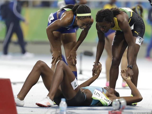 Her opponents clearly admired Miller for what she achieved. Even Felix looks down at Miller with a huge smile on her face. (AP) Her opponents clearly admired Miller for what she achieved. Even Felix looks down at Miller with a huge smile on her face. (AP)