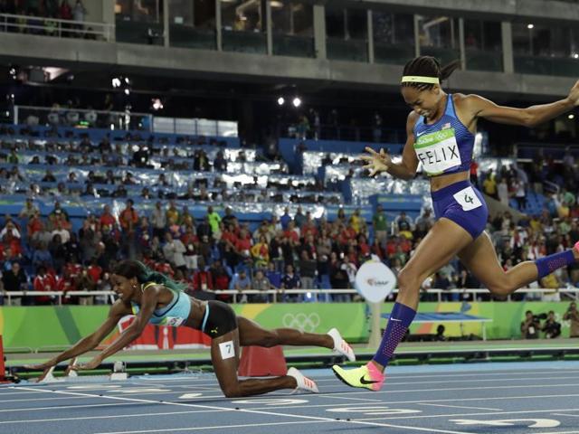 Shaunae Miller (left) of Bahamas dived across the finish line to win gold ahead of Allyson Felix of USA in the 400m, women’s final in Rio on Monday. (REUTERS) Shaunae Miller (left) of Bahamas dived across the finish line to win gold ahead of Allyson Felix of USA in the 400m, women’s final in Rio on Monday. (REUTERS)