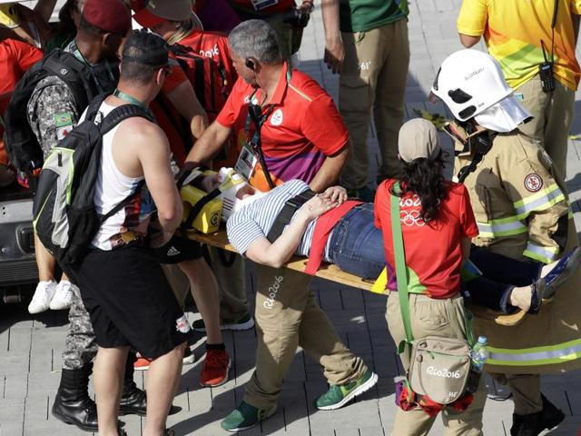 An overhead camera that fell from wires suspending it over the Olympic Park lies on the ground.(AP)