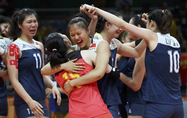 Chinese players celebrate their upset win over Brazil. (REUTERS Photo) Chinese players celebrate their upset win over Brazil. (REUTERS Photo)