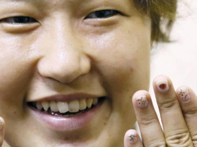 Japanese rugby captain Chiharu Nakamura shows off her artfully painted tips. (Twitter) 