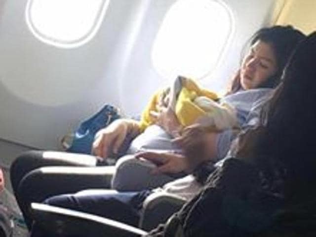 Flight attendants and nurses cleaned the baby with mineral water and dressed her in baby clothes donated by fellow passengers flying with infants (Facebook/Missy Berberabe Umandal) Flight attendants and nurses cleaned the baby with mineral water and dressed her in baby clothes donated by fellow passengers flying with infants (Facebook/Missy Berberabe Umandal)