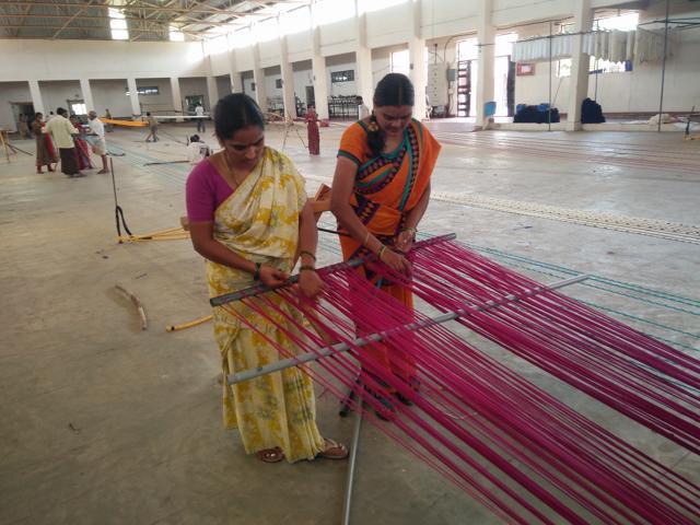Women weavers sorting out dyed threads before the weaving process begins. (Handout image) Women weavers sorting out dyed threads before the weaving process begins. (Handout image)