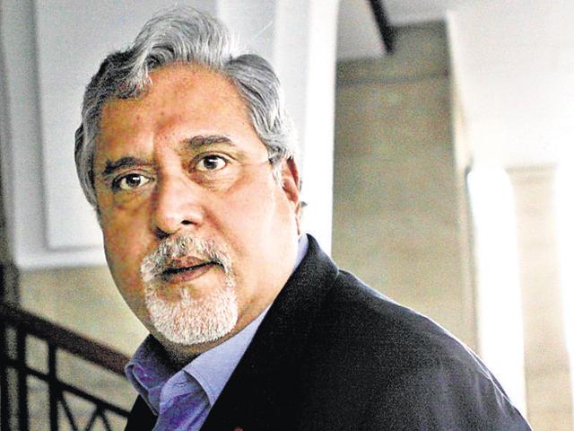 In this photograph taken on December 16, 2013, industrialist and MP Vijay Mallya arrives at Parliament in New Delhi.(AFP File Photo)