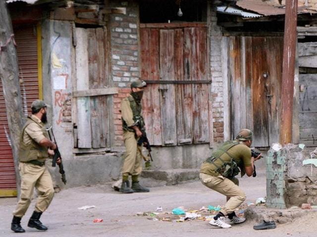 Special Operation Group (SoG) of Jammu and Kashmir Police personnel take positions during an encounter with the militants at Nowhatta in Srinagar on Monday. Militants staged another attack on Wednesday morning. (PTI Photo) Special Operation Group (SoG) of Jammu and Kashmir Police personnel take positions during an encounter with the militants at Nowhatta in Srinagar on Monday. Militants staged another attack on Wednesday morning. (PTI Photo)
