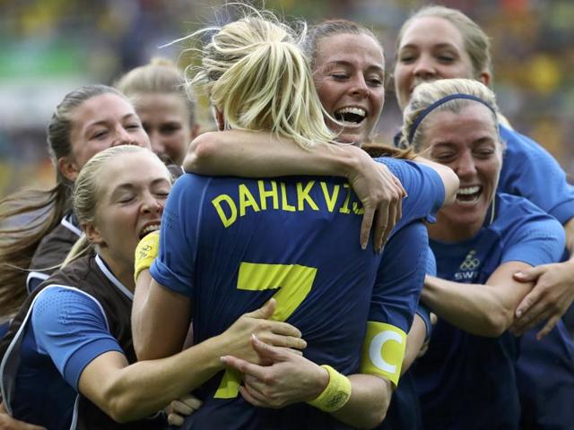 Lisa Dahlkvist (SWE) of Sweden (C) celebrates with teammates after scoring the winning goal. (REUTERS) Lisa Dahlkvist (SWE) of Sweden (C) celebrates with teammates after scoring the winning goal. (REUTERS)