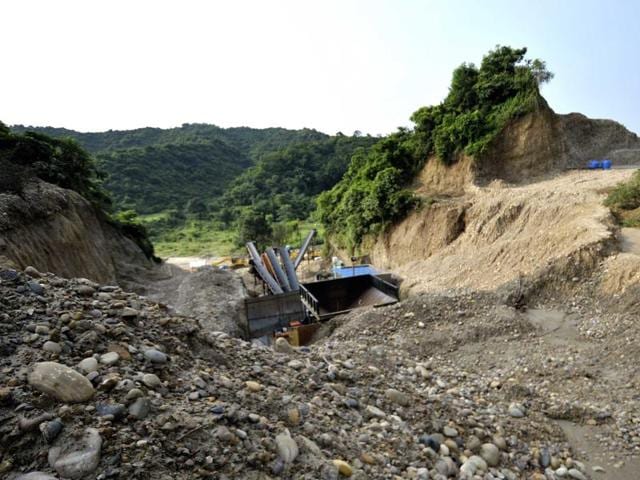 Two hillocks stood here until this stone crusher started cutting the Shivalik foothills of Sukhchainpur village near Talwara in Hoshiarpur district. (Ravi Kumar/HT Photo) Two hillocks stood here until this stone crusher started cutting the Shivalik foothills of Sukhchainpur village near Talwara in Hoshiarpur district. (Ravi Kumar/HT Photo)