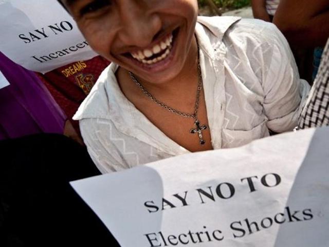 A mentally challenged youth holds a placard during a protest outside the Indian Health Ministry in New Delhi.(AFP Photo)