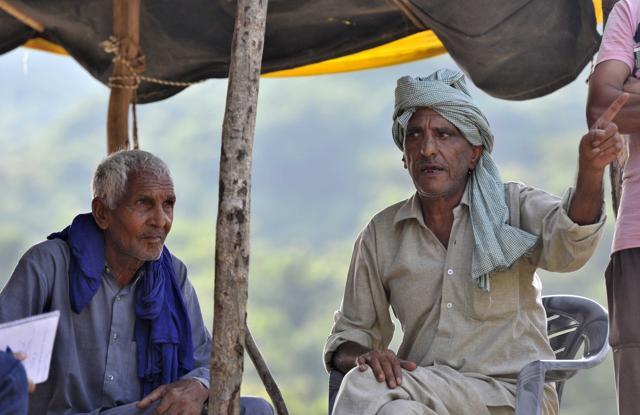 Village elder Jaswant Singh points out to the danger of flash flood because of the ravaging of hillocks (Ravi Kumar/HT Photo) Village elder Jaswant Singh points out to the danger of flash flood because of the ravaging of hillocks (Ravi Kumar/HT Photo)