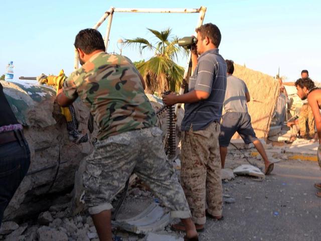 Members of Libyan pro-government forces hold a position as they fight to clear the Islamic State group from its main Libyan stronghold of Sirte on August 13, 2016 in Sirte, east of the capital Tripoli. (AFP) Members of Libyan pro-government forces hold a position as they fight to clear the Islamic State group from its main Libyan stronghold of Sirte on August 13, 2016 in Sirte, east of the capital Tripoli. (AFP)