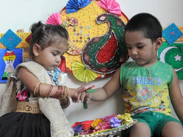 Tiny tots of Maple Bear School celebrating Raksha Bandhan in Ludhiana on Wednesday. (HT Photo)