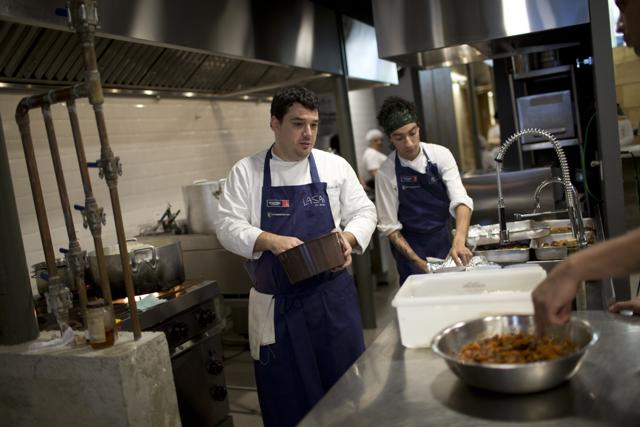Using leftover ingredients from Olympic caterers and other local partners, the gourmet soup kitchen has been serving up meals to Rio’s homeless population for a week now. (AP Photo) Using leftover ingredients from Olympic caterers and other local partners, the gourmet soup kitchen has been serving up meals to Rio’s homeless population for a week now. (AP Photo)