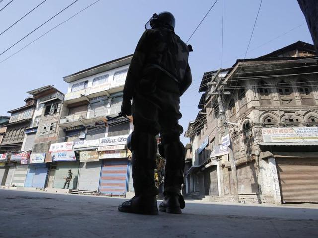A paramilitary soldier stands guard on a street with closed shops and stores in the Maisuma area of Srinagar. (File Photo) A paramilitary soldier stands guard on a street with closed shops and stores in the Maisuma area of Srinagar. (File Photo)