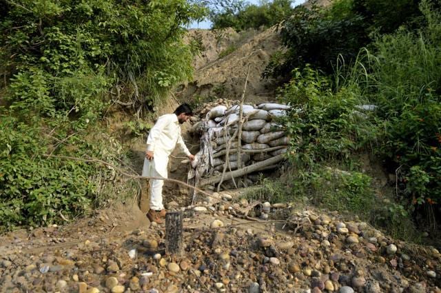The point where the villagers plugged a breach, as a stream changed its course in early August. (Ravi Kumar/HT Photo) The point where the villagers plugged a breach, as a stream changed its course in early August. (Ravi Kumar/HT Photo)