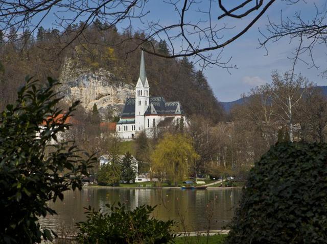 Republic of Slovenia, which was formerly a part of Yugoslavia, is a central European nation, located at the crossroads of main European cultural and trade routes. In this April 16, 2013 photo, a church is seen on the shore of Lake Bled, northern Slovenia.  (AP) 