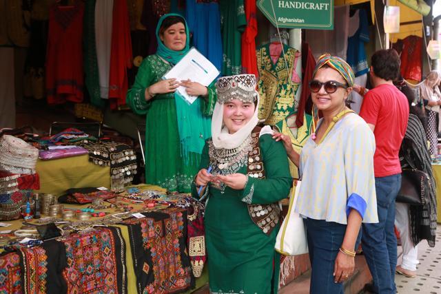 Fashion desginer Anupamaa Dayal at one of the stalls set up by women from Afghanistan. (Amal KS/HT Photo)