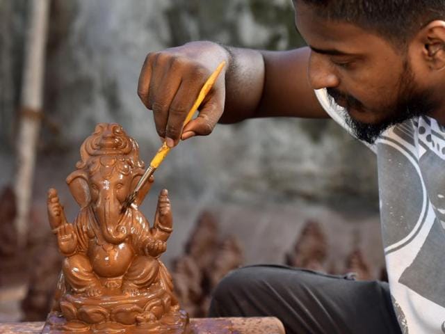 Going Green: Dattadri Kothur,30, makes an eco–friendly Ganesha (Tree Ganesha) idol at his Lower Parel workshop. (Kunal Patil) 
