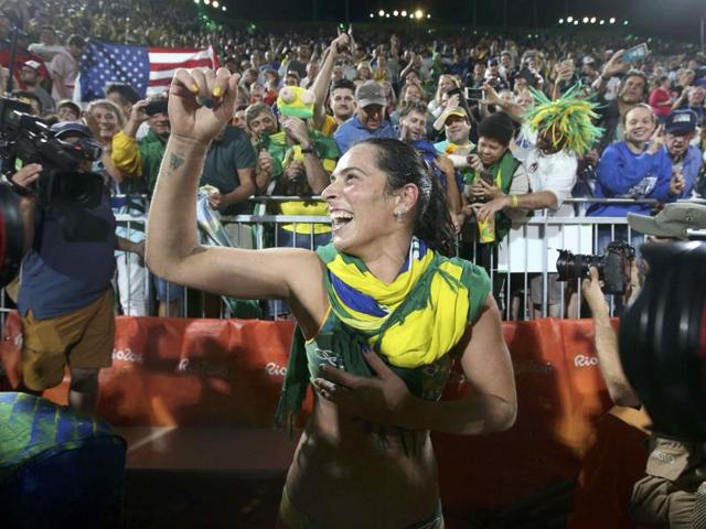 Agatha Bednarczuk of Brazil celebrates after winning the beach volleyball semifinal against the USA on Wednesday. (REUTERS)