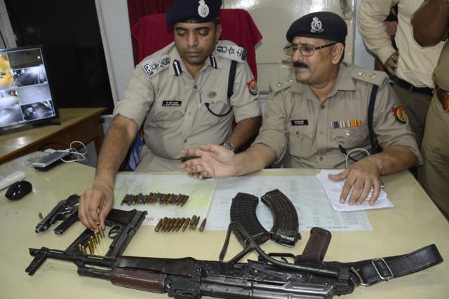 Police show the arms recovered. (Sakib Ali / HT Photo)