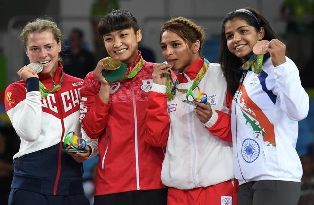 From left to right: Silver medallist Valeria Koblova of Russia, gold medallist Kaori Icho of Japan, and bronze medallists Marwa Amri of Tunisia and India's Sakshi Malik pose with their medals during the medals ceremony. (PTI) From left to right: Silver medallist Valeria Koblova of Russia, gold medallist Kaori Icho of Japan, and bronze medallists Marwa Amri of Tunisia and India's Sakshi Malik pose with their medals during the medals ceremony. (PTI)
