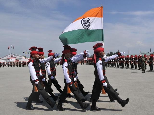 New recruits of Jammu and Kashmir Light Infantry Regiment (JKLIR) carry the national flag during their passing out parade at an army base on the outskirts of Srinagar. (Waseem Andrabi/HT Photo) New recruits of Jammu and Kashmir Light Infantry Regiment (JKLIR) carry the national flag during their passing out parade at an army base on the outskirts of Srinagar. (Waseem Andrabi/HT Photo)