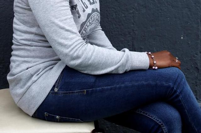 The legs of Eritrean migrant Ruta Fisehaye are seen as she poses for a photograph. (Reuters Photo)