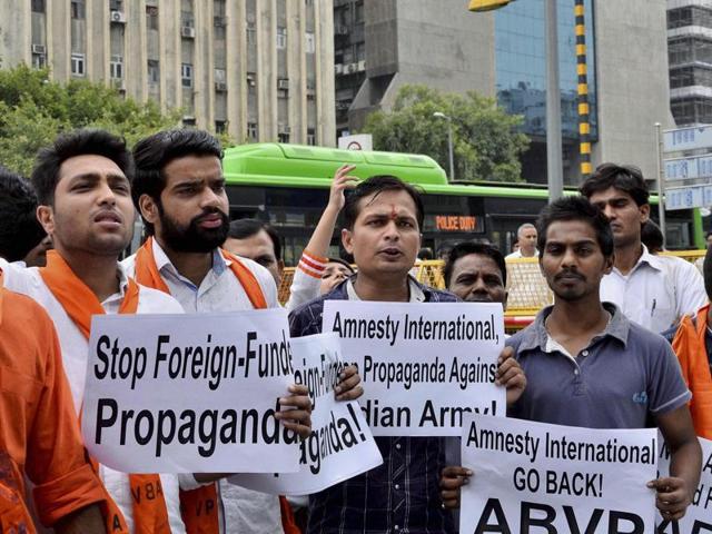 ABVP activists shout slogans at a protest against Amnesty International India in New Delhi.(PTI Photo)