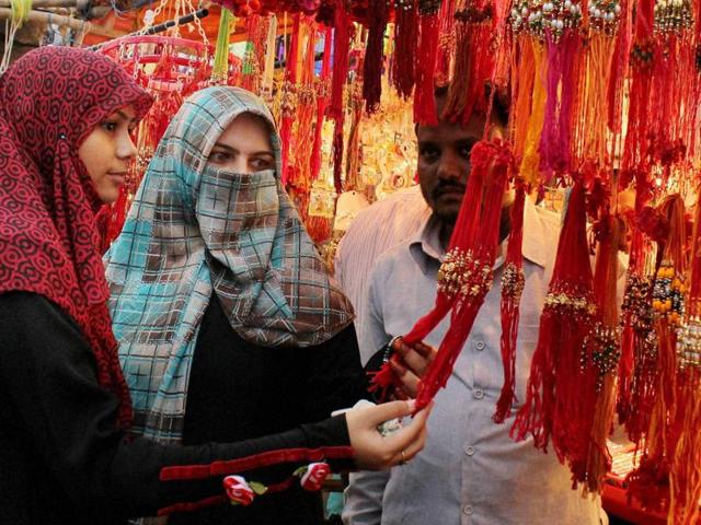 Muslim women selecting Rakhi at a market on the eve of Raksha Bandhan festival in Nagpur on Wednesday. (PTI) Muslim women selecting Rakhi at a market on the eve of Raksha Bandhan festival in Nagpur on Wednesday. (PTI)