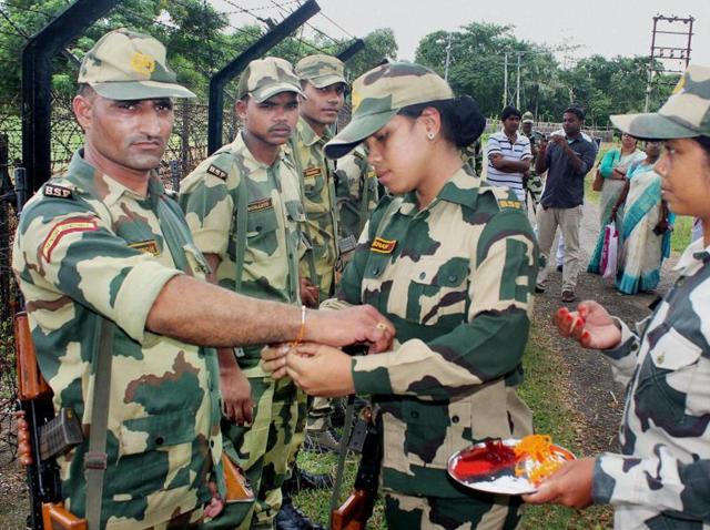 Women constables of the Border Security Force (BSF) tie rakhi to their male colleagues during the celebrations of Raksha Bandhan festival at the India-Bangladesh Border near Balurghat in South Dinajpur district of West Bengal. (PTI) Women constables of the Border Security Force (BSF) tie rakhi to their male colleagues during the celebrations of Raksha Bandhan festival at the India-Bangladesh Border near Balurghat in South Dinajpur district of West Bengal. (PTI)