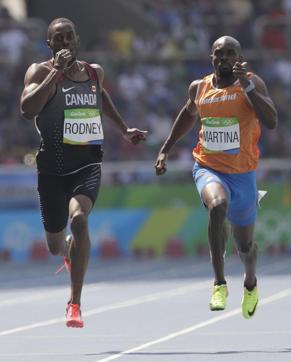 Canada's Brendon Rodney, left, and Netherlands' Churandy Martina. (AP) Canada's Brendon Rodney, left, and Netherlands' Churandy Martina. (AP)