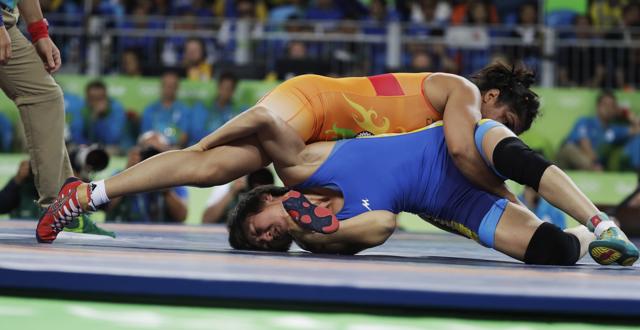 India's Sakshi Malik, top, competes against Kyrgyzstan's Aisuluu Tynybekova. (AP Photo) India's Sakshi Malik, top, competes against Kyrgyzstan's Aisuluu Tynybekova. (AP Photo)