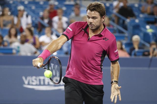 Stan Wawrinka hits a backhand against Jared Donaldson. (AP) Stan Wawrinka hits a backhand against Jared Donaldson. (AP)