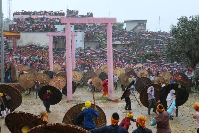 The participants carry big wooden shields to protect themselves from the fling stones. (Rajeev Kala/ HT Photo)