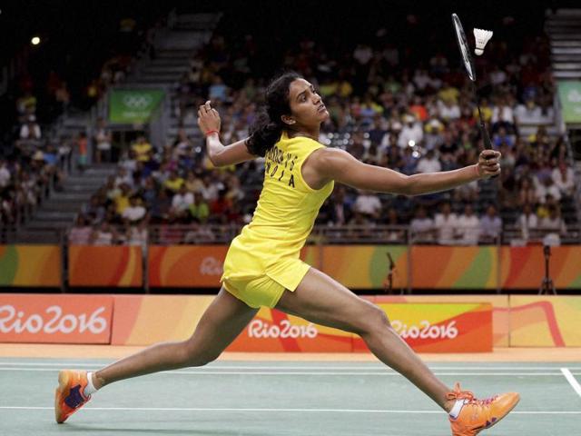 PV Sindhu of India clasps hands with Nozomi of Japan over the net after winning their match.(Reuters)