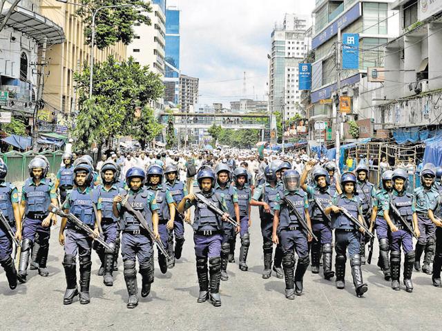 File photo of Bangladeshi police standing guard in front the house where police killed nine suspected Islamist extremists in Dhaka on July 26. (AFP) File photo of Bangladeshi police standing guard in front the house where police killed nine suspected Islamist extremists in Dhaka on July 26. (AFP)