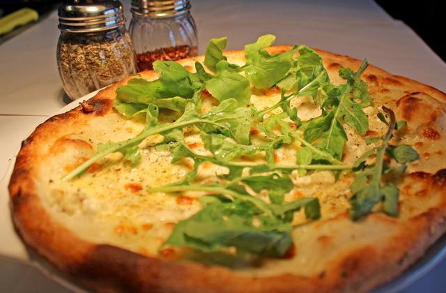 The base of the white rocket pizza was so hard, it felt like eating buttered toast with a cheese sauce. (Satyabrata Tripathy/ HT Photo )