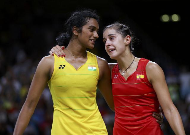 Carolina Marin talks to PV Sindhu after winning their women’s singles badminton match. (Reuters Photo) Carolina Marin talks to PV Sindhu after winning their women’s singles badminton match. (Reuters Photo)