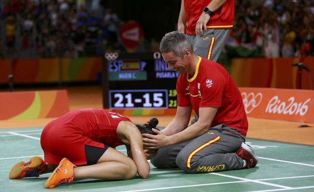 Marin celebrates with her coach Fernando Rivas after winning the match against PV Sindhu. (Reuters Photo) Marin celebrates with her coach Fernando Rivas after winning the match against PV Sindhu. (Reuters Photo)