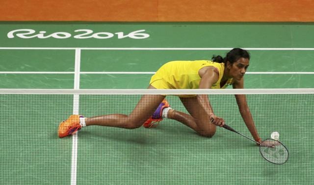 Sindhu goes on her knees to return a shot to Carolina Marin during their women’s singles final, in Rio de Janeiro. (Reuters Photo) Sindhu goes on her knees to return a shot to Carolina Marin during their women’s singles final, in Rio de Janeiro. (Reuters Photo)