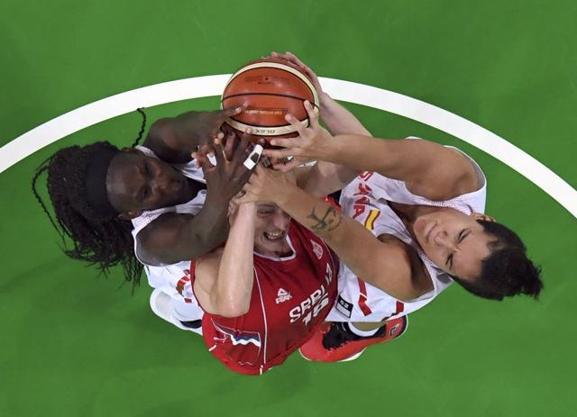 Astou Ndour Gueye (left) and Laura Nicholls (right) of Spain , vie with Danielle Page of Serbia during the women’s basketball semifinals. (REUTERS) Astou Ndour Gueye (left) and Laura Nicholls (right) of Spain , vie with Danielle Page of Serbia during the women’s basketball semifinals. (REUTERS)