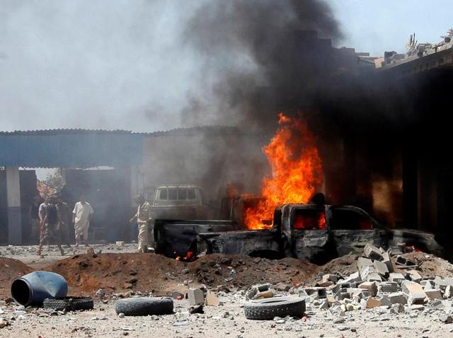 A view of the scene following a car bomb attack in al-Gharbiat in Sirte. (REUTERS) A view of the scene following a car bomb attack in al-Gharbiat in Sirte. (REUTERS)