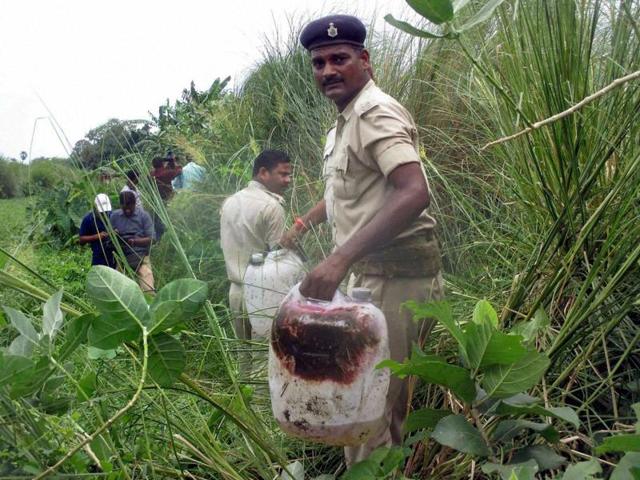 Police recovered what is suspected to be liquor in a field at Harkhua Khajurbari village, in Gopalganj district of Bihar. (PTI Photo) Police recovered what is suspected to be liquor in a field at Harkhua Khajurbari village, in Gopalganj district of Bihar. (PTI Photo)