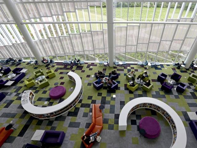 Students in the Rain Garden Reading Lounge inside the Hunt Library at North Carolina State University. The updates to the building were designed to help students learn in comfort by themselves or in groups. It offers quiet spaces and group study rooms as well as high definition video walls, 3D computing and video conferencing facilities. (AP) 