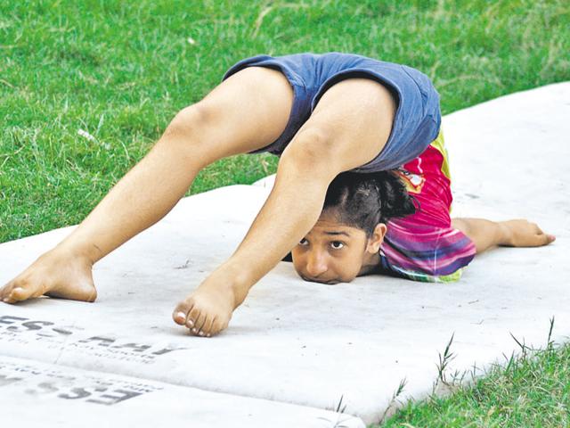 A gymnast practising in Jalandhar on Wednesday.(Sikander Singh Chopra/HT Photo)
