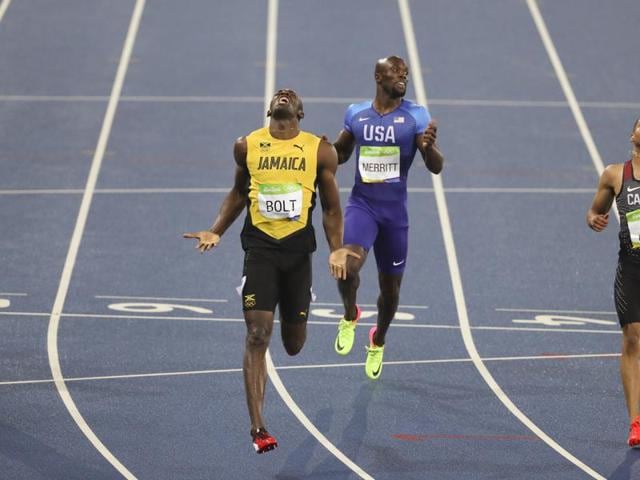 Usain bolts into history books again with third successive 200m Olympic gold(AP Photo)