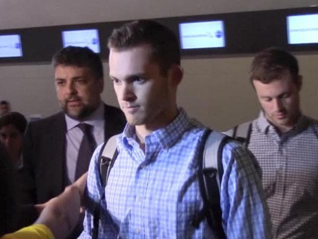 In this image made from video, American Olympic swimmers Gunnar Bentz and Jack Conger walk in the departure area after checking into their flight at the airport in Rio de Janeiro, Brazil, on August 18, 2016. (AP) In this image made from video, American Olympic swimmers Gunnar Bentz and Jack Conger walk in the departure area after checking into their flight at the airport in Rio de Janeiro, Brazil, on August 18, 2016. (AP)